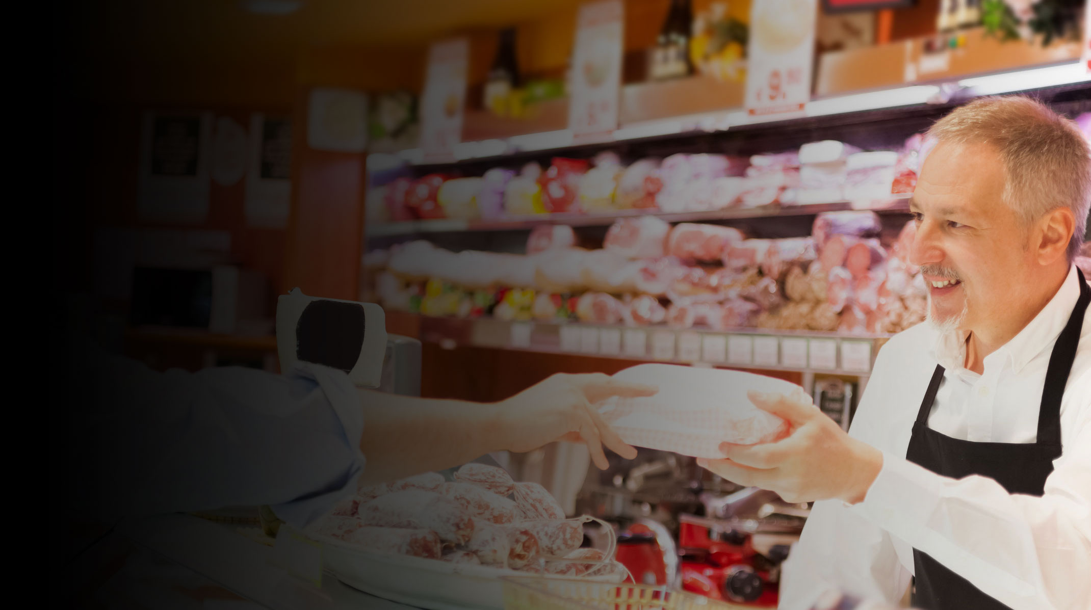 Butcher serving a customer at IGA Nerang